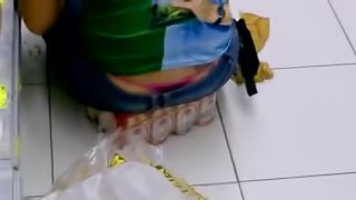 Girl's thong stick out of her jeans in supermarket