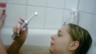 Blonde german girl teases her bf by masturbating her shaved pussy with an electrical toothbrush in the bathtub