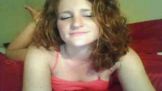 Redhead slut fucks her pussy on cam