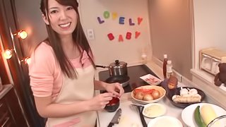 Smiley Japanese babe giving her man superb blowjob before having her pussy drilled with toy in the kitchen