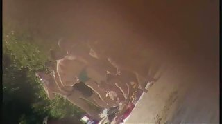 Cute brunette with black thong in the beach video