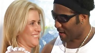 Black cock meets a blonde MILF in this interracial vid