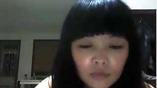 Chinese girl plays with her hairy pussy