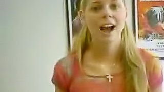 Pigtailed blonde shows her shaved puss