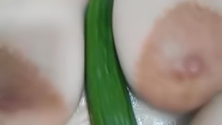 Wanking my huge tits with a cucumber and fucking my pusy with the shower