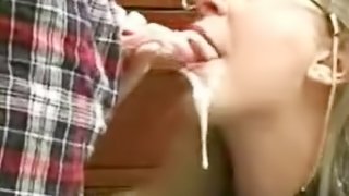 Innocent looking milf  sucks a huge pipe and gets an oral creampie from it.
