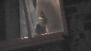 Raunchy window voyeur pics of the hot round titties