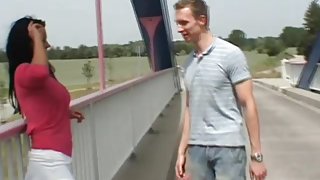 Busty German Milf sucks and fucks outdoor on a bridge
