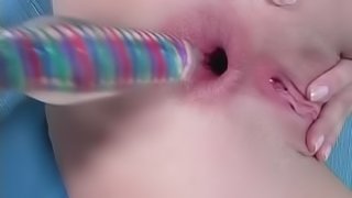 Misty Mild slams her pussy and asshole with a dildo