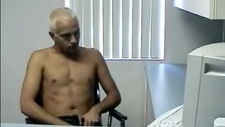 A gay stud massages his balls while jerking his cock and cumming