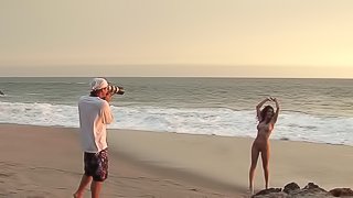 Sexy goddess is posing naked on the beach