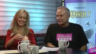 Blonde lesbian cougar with a hot body laughing and chatting backstage