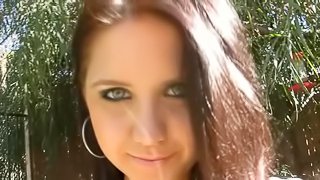 Very beautiful brunette  teasing outdoors