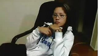 Amateur Asian teen with glasses fingers herself on cams
