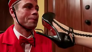 Hotel Guest Maitresse Madeline Dominates the Bellboy in Foot Fetish Video