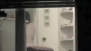 I am voyeuring neighbor in panty in the window