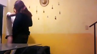 Dude fucks a girl standup doggystyle in the living room