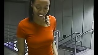 Black bitch gives a handjob to a white dude indoors