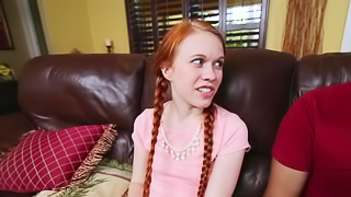 A redhead with pigtails is making one dude really happy